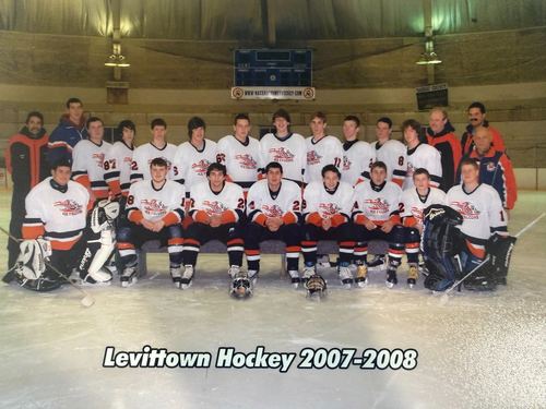 Full team portrait on the ice with two trophies, captioned Levittown Hockey 2007-2008